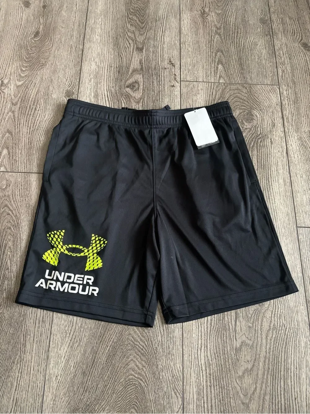 Under Armour boys Black Performance Shorts with Yellow Logo
